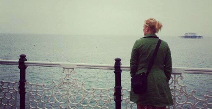 Shannon Fisher looking out over the ocean alone