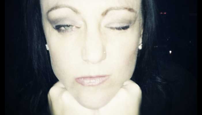 dark image of Shannon looking at you