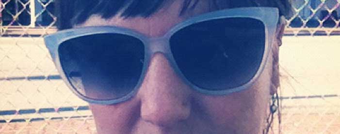 close up of sunglasses on Shannon Fisher