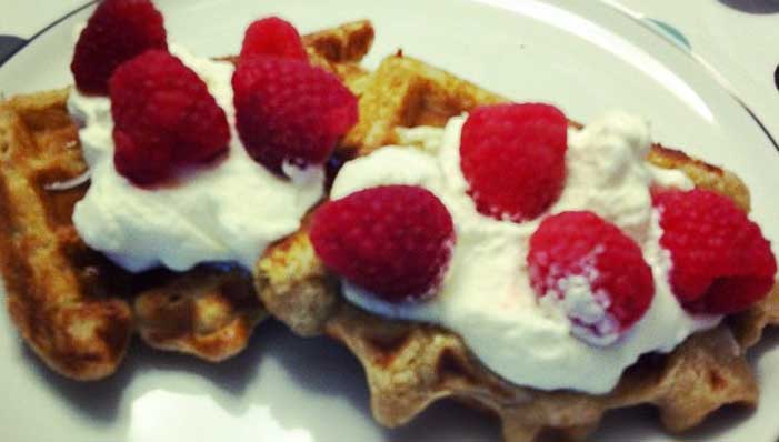 waffles with raspberries and whip cream