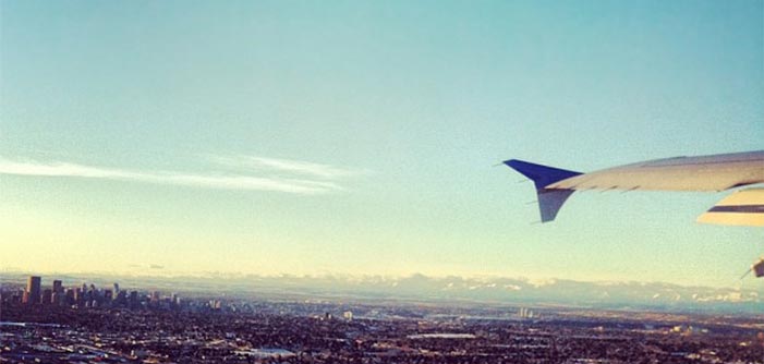 Shannon Fisher on a plane flying over Calgary Alberta