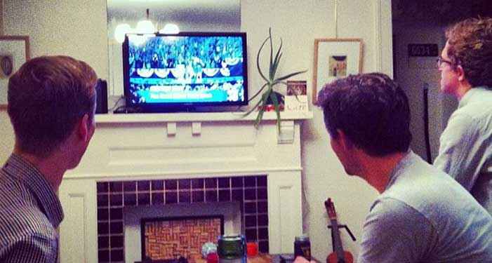 Three guys watching Obama win the election