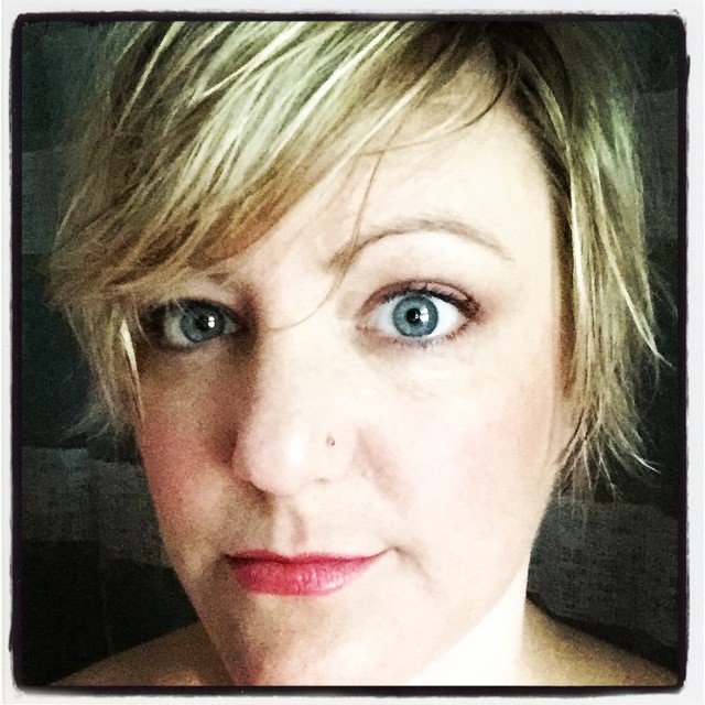 close up picture of shannon with a neutral facial expression